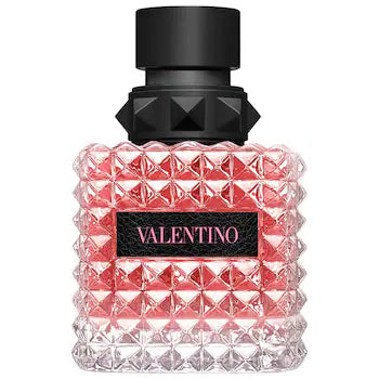 A decant of Donna Born In Roma Eau de Parfum by Valentino, featuring a pink fragrance bottle with a geometric pattern and black cap.