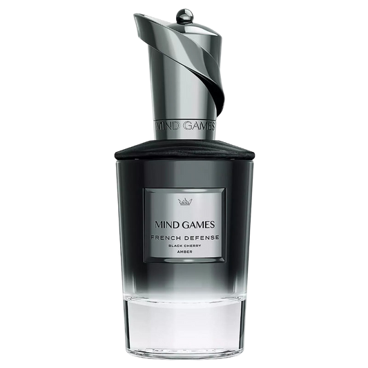 A sleek, modern decanter of Mind Games French Defense fragrance, with a dark label and a metallic cap.